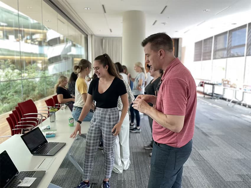 Researchers, scientists, and staff in the Discovery Building attend the final Science Showcase as the camp participants become the presenters.