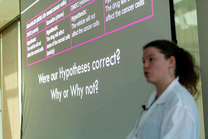 Morgridge postdoctoral researcher Amani Gillette leads a discussion in how to analyze and interpret results in support of (or against) the group’s experimental hypotheses.