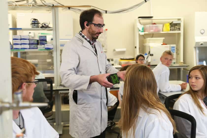 Morgridge Outreach Coordinator Dan Murphy shows off the plants students use in an experiment on epigenetics, exploring how genes can be turned on and off due to signals in the environment.