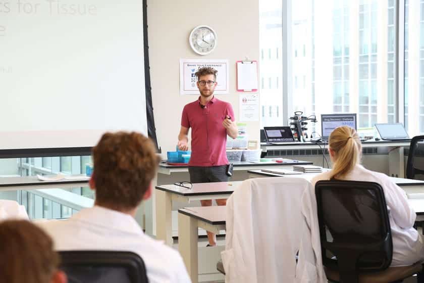 Teddy de Groot, formerly of the Beebe lab and currently a lead engineer at Lynx Biosciences, explains microfluidics technology to students at the 2017 Rural Summer Science Camp.