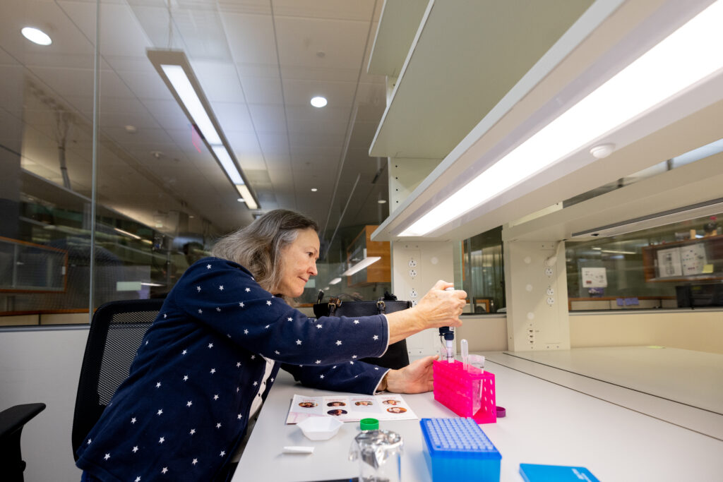 A guest practices her pipetting skills.