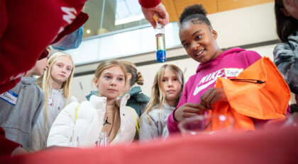 Students looking at a test tube