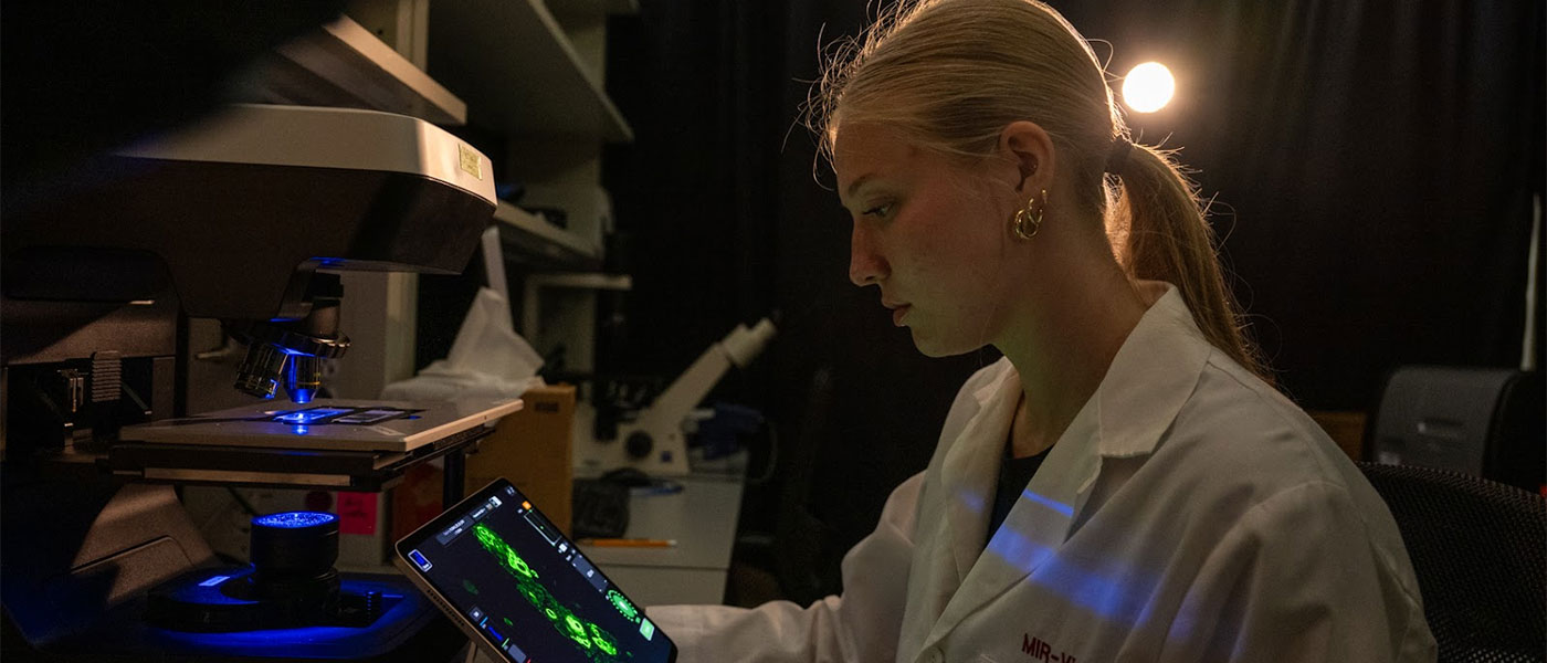 Scientist at a microscope
