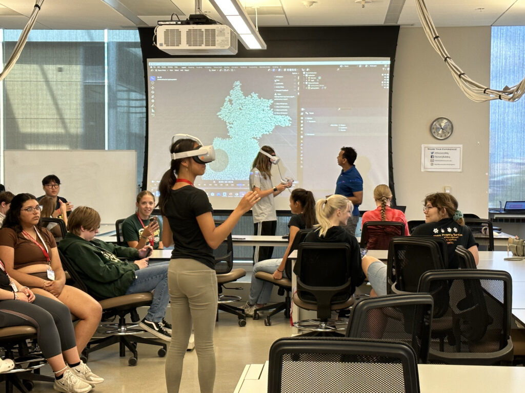 Science campers explore how virtual reality and artificial intelligence can be applied to studying biological concepts, like protein structure.